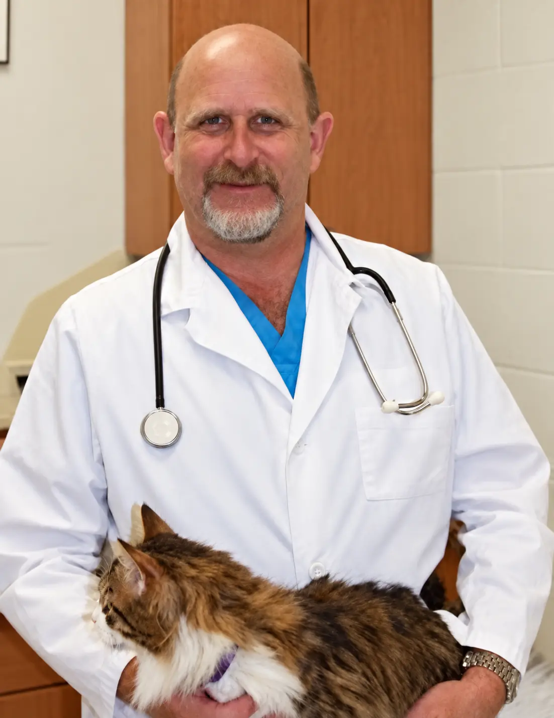 Dr. Frederick A. Frye Jr. holding a cat